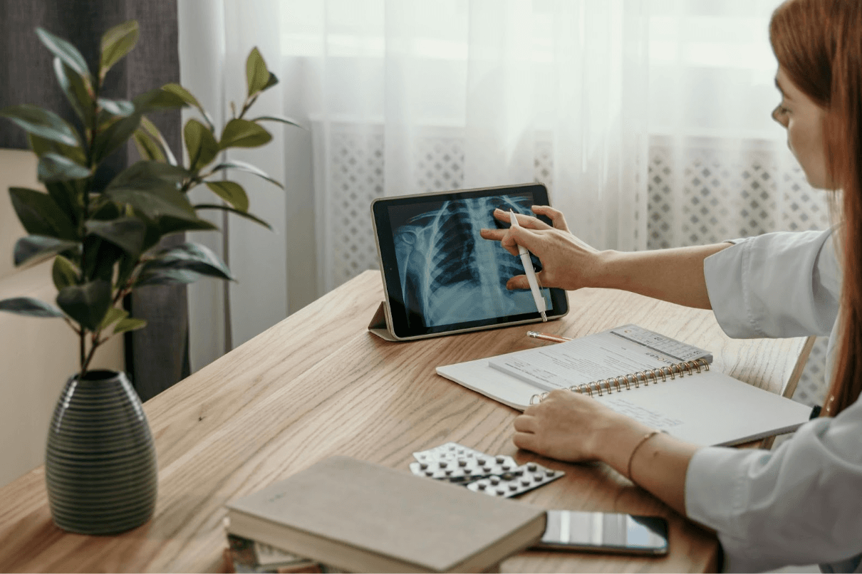 Digital Health Article - Illustration 1 Doctor at his desk using a tablet
